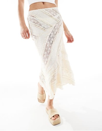 lace top with spilt asymmetric hem in white