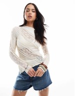 lace top with spilt asymmetric hem in white
