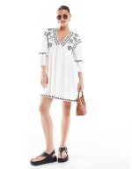embroidered smock mini dress in white
